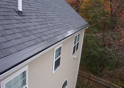 Roofline view of Gutter Cap following a steep gable