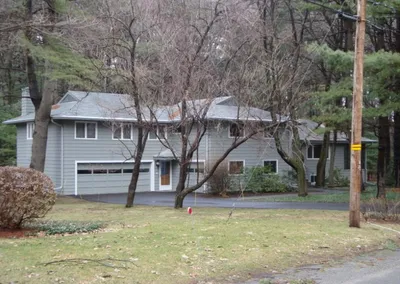 Ranch home with Gutter Cap installed along the front roofline