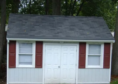 Gutter Cap protecting the gutters of a backyard shed