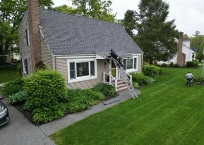 Cape-style home getting Gutter Cap installed