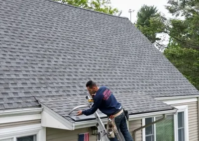Installer fitting Gutter Cap sections at the roof edge