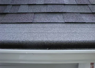 Close-up of the Gutter Roof panel tucked under the shingles
