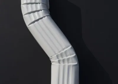 White aluminum S elbow downspout fitting
