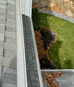 Looking down at a screened gutter and the lawn below
