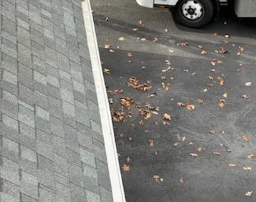 View down a screened roof edge to the truck parked below