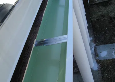 Close-up of freshly formed seamless gutter stock