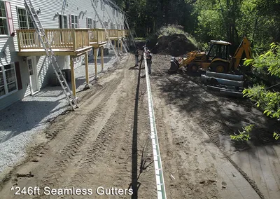 246 feet of seamless gutter sections staged at a job site