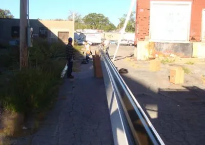 Seamless gutter run staged along a driveway