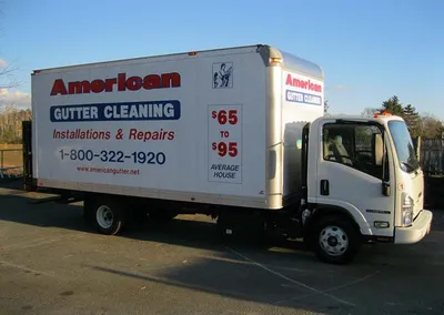 American Gutter Cleaning box truck with cleaning pricing on the side