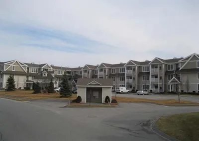 Seamless gutters installed across a condominium complex