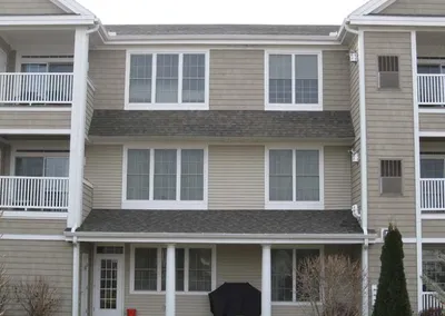 Completed gutters on a three-story multi-family building